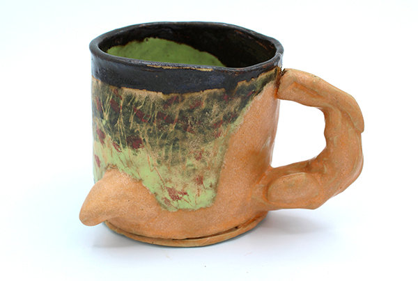 John Gill Cup
Multicolored hand-built cup. 3.75” wide 3.625” tall 
Cup has a space at the seamline which will affect drinking if the cup is used functionally. Gill is known for creating abstracted forms that are influenced by a modernist approach to ceramics.
His work is in the Harvey Preston Gallery
https://harveypreston.com