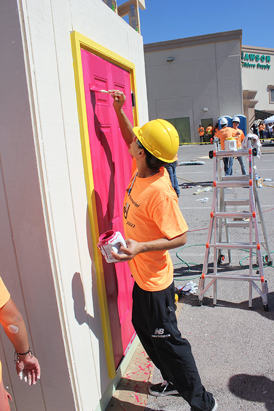 Enrique Dunlap of Centennial High School paints a door at the Build My Future event Oct. 11 at Rawson Builders Supply. The annual Build My Future event is presented by the Las Cruces Home Builders Association to help show young people the variety of jobs available in the building and trades industry.