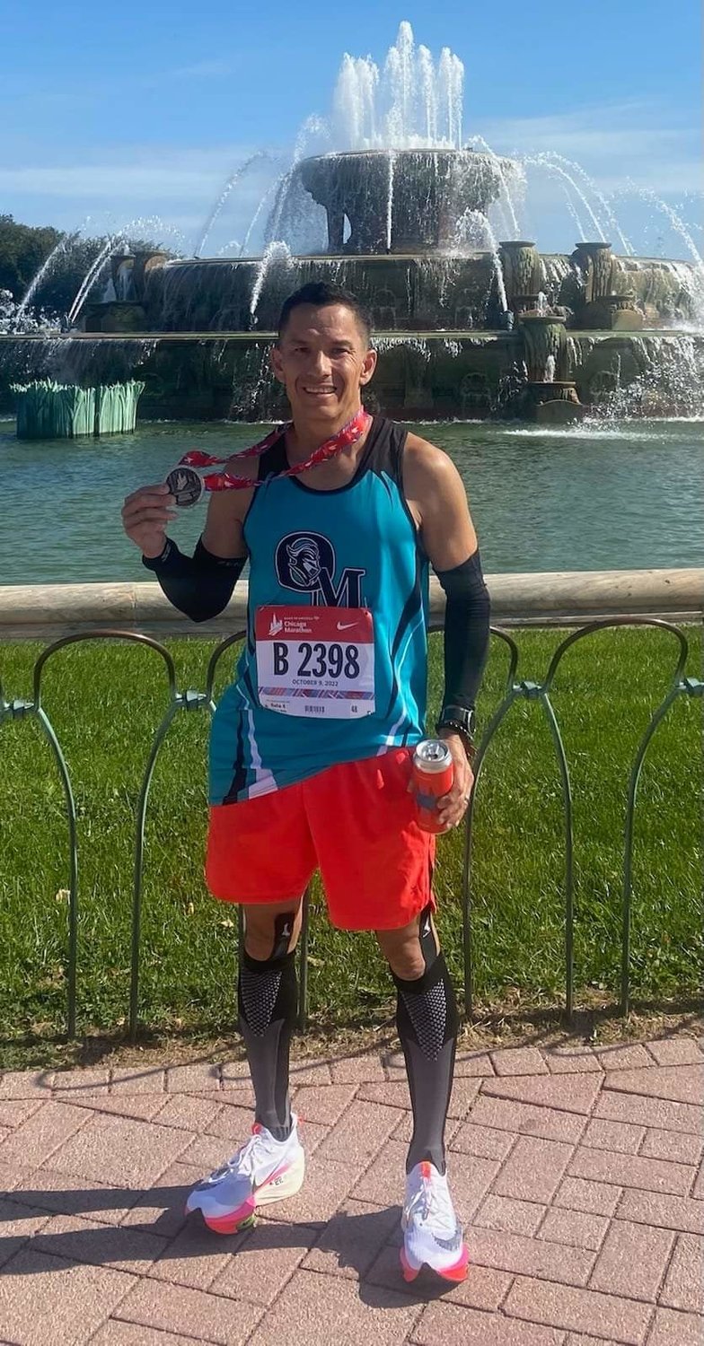 Las Cruces Catholic School Principal Adrian Galaz improved his running time in Chicago Marathon by about an hour.