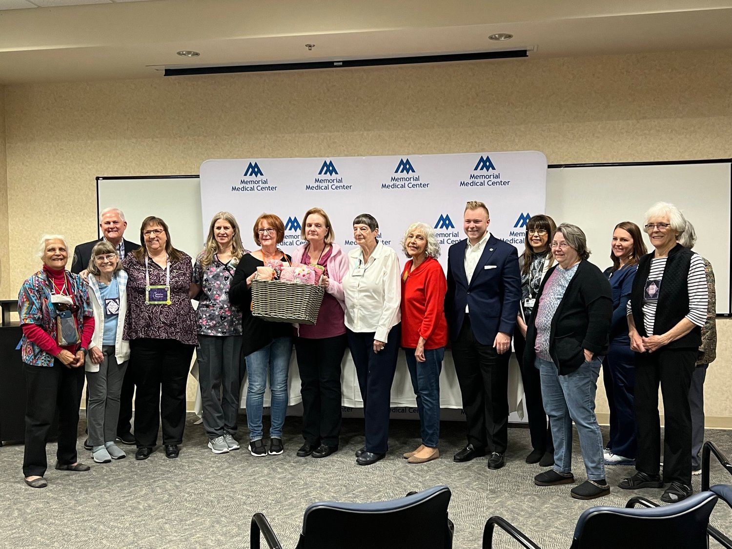 Members of Las Colcheras Quilt Guild along with staff and management at Memorial Medical Center gather for the presentation of 200 pillows for breast cancer patients at the hospital’s cancer center.