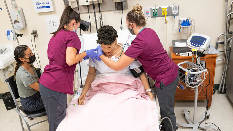 Nursing students at New Mexico State University participate in a class last November.