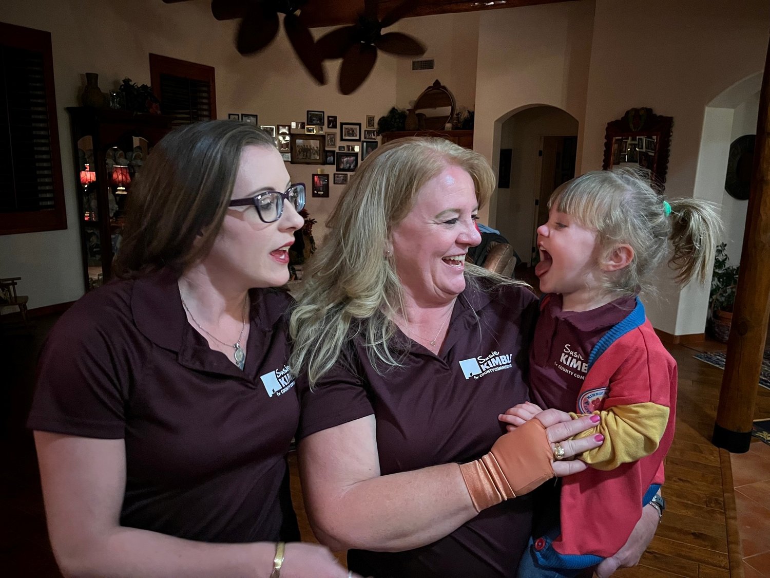 During a political watch party on election night, candidate Susie Kimble, center, enjoys a light moment with her daughter Maryalice Allred and her granddaughter, Caroline, age 2.