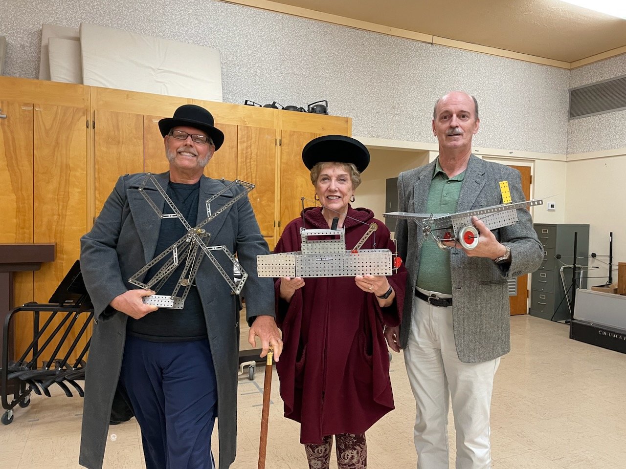 Left to right are Daniel Taylor as Government Council-Secretary Baker, Karen Warren as a factory worker and Don Harlow as A.C. Gilbert.