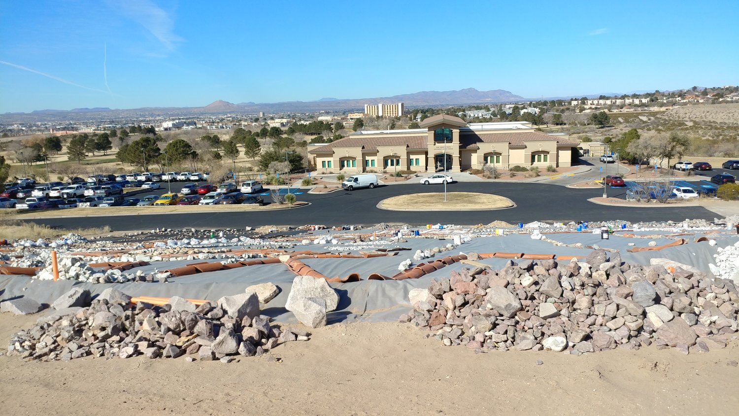 The view of the NMSU golf course club house from atop the hill where Kathy Morrow is creating her rock art project