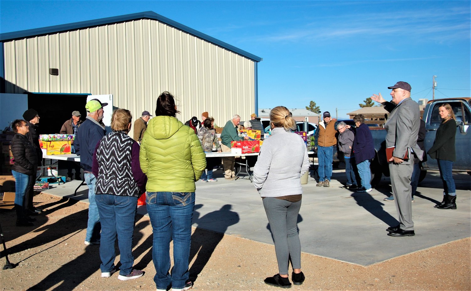 East Mesa Baptist Church interim Pastor Stephen Kovach welcomes East Mesa residents, visitors and volunteers to the dedication of the church’s new food pantry.