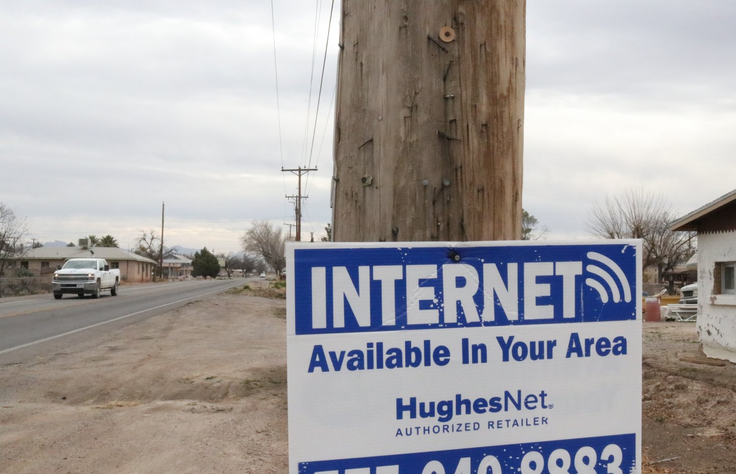 A poster advertising satellite-based internet service is seen Dec. 9, 2022 in the farming community of La Mesa, 17 miles south of Las Cruces on N.M. Hwy. 28. New Mexicans face a Jan. 13 deadline to verify their internet speeds on a federal broadband map – a step that will be key to getting funding for faster internet in the future. Residents in several communities across Southern New Mexico say they struggle to access affordable, reliable high-speed internet due to limited options.