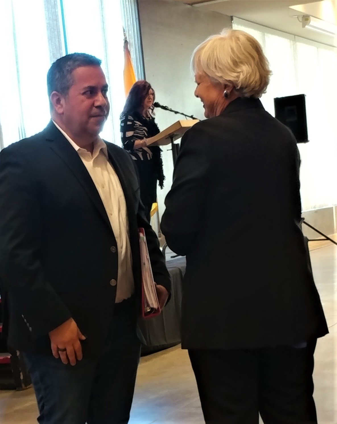 State Rep. Joanne Ferrary of Las Cruces talks to U.S. Sen. Ben Ray Lujan at the Greater Las Cruces Chamber of Commerce’s legislative sendoff luncheon Jan. 11 at the New Mexico Farm & Ranch Heritage Museum.