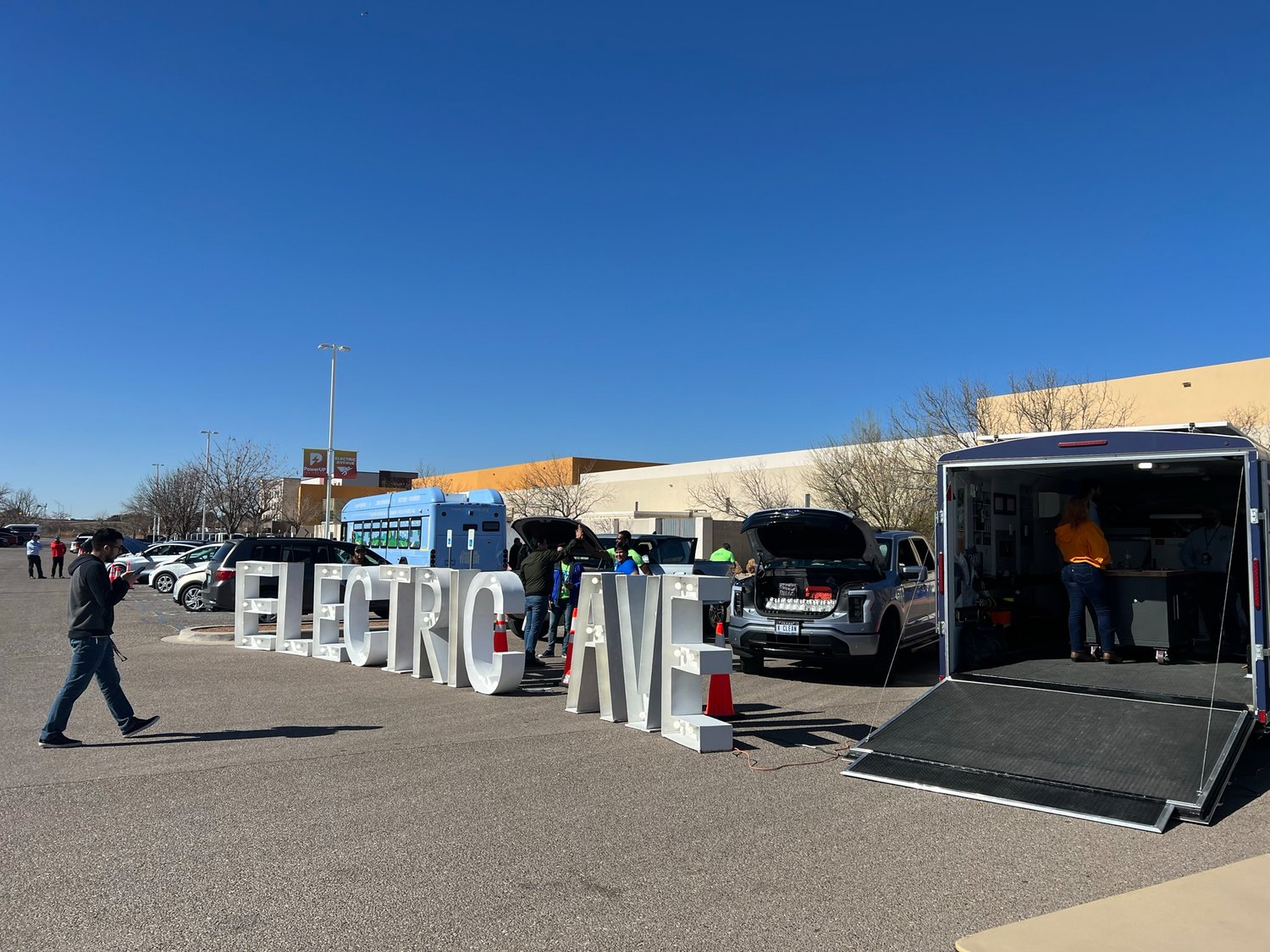 The Las Cruces PowerUP expo welcomes visitors to enter along Electric Avenue where all kinds of electric and energy efficient vehicles are on display from bicycles to a Ford F-150 Lightning.