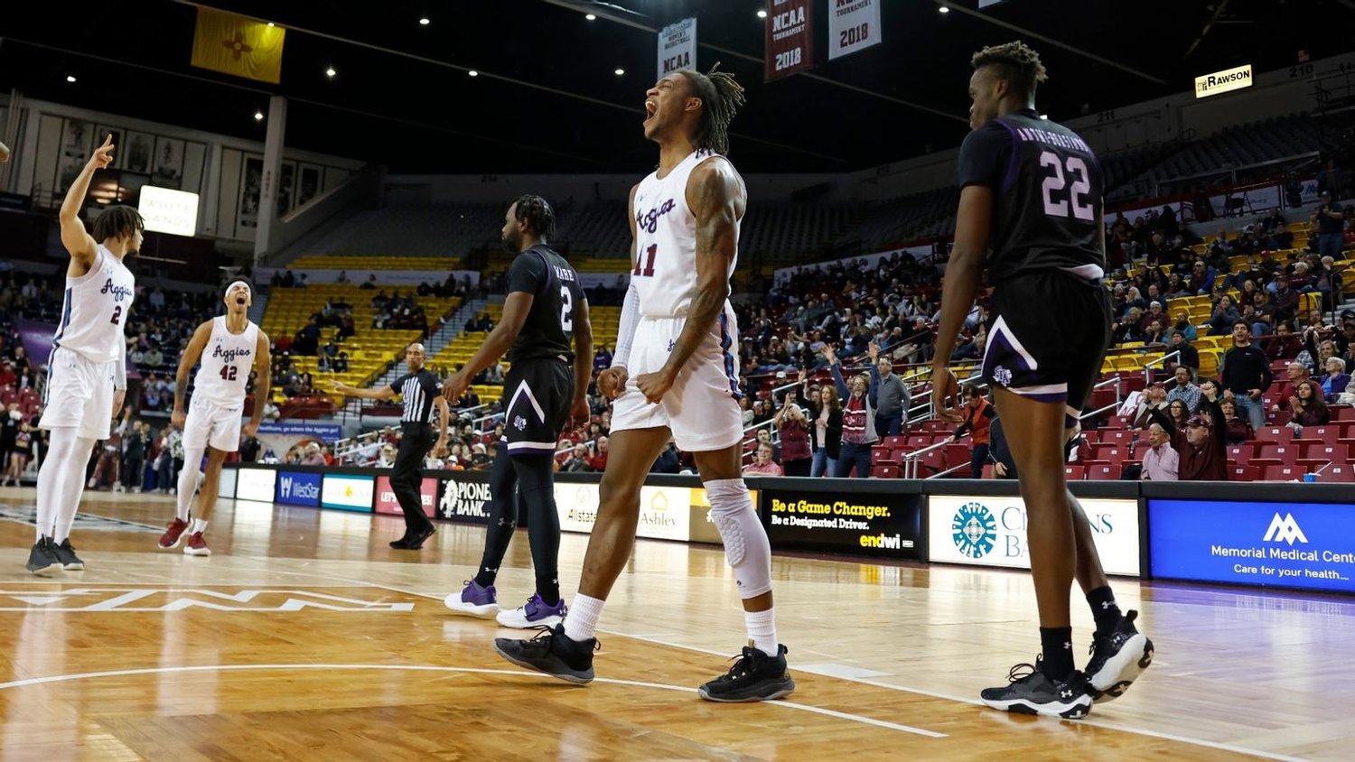 DaJuan Quaye Gordon exults after a slam dunk Feb. 1 as the Aggies earned their first Western Athletic Conference game of the season, defeating Stephen F. Austin 73-67 in the Pan Am Center. They will host Seattle 7 p.m. Saturday, Feb. 4, preceded by the Aggie women playing Grand Canyon in a 4 p.m. game.