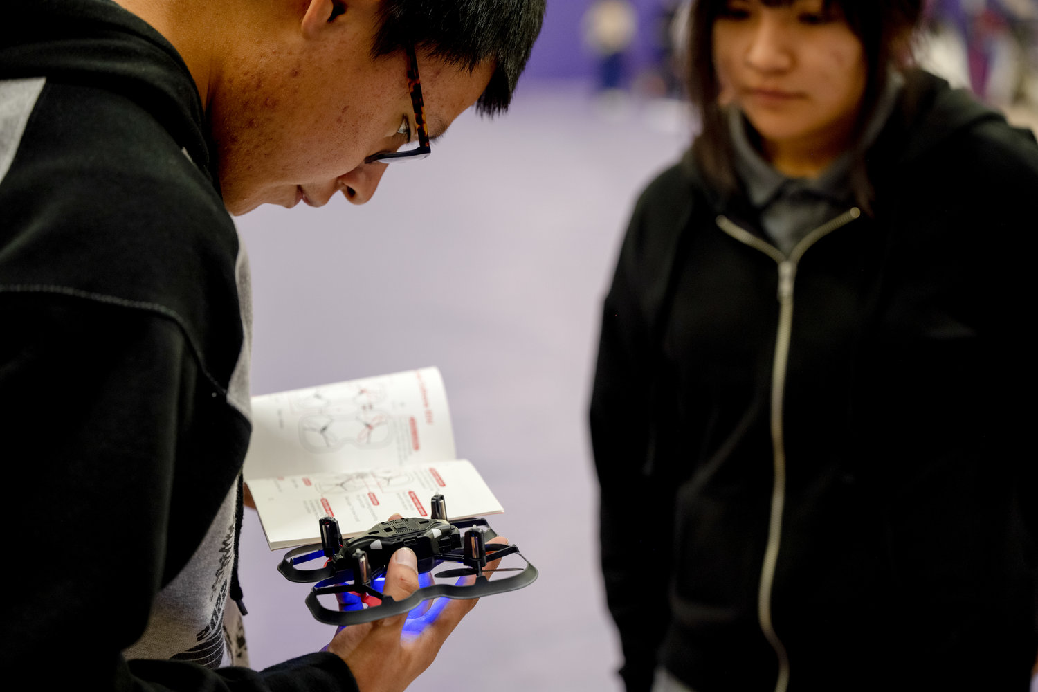 Clarence Sago, left, and Caydence Palmer, Mescalero Apache High School students, prepare their drones for the first Aerial Drone Competition at Mescalero Apache High School, Jan. 21, 2023. Two drones are allowed in the competition, the CoDrone EDU and the Parrot Mambo drone, each of which  has seven built-in sensors including an accelerometer, gyroscope, barometer, front range sensor, bottom range sensor, color sensor and an optical flow sensor. (U.S. Air Force photo by Senior Airman Antonio Salfran)