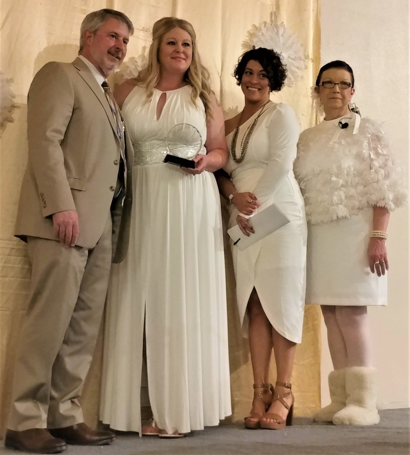 Left to right are Greater Las Cruces Chamber of Commerce Board President Craig Buchanan, the chamber’s 2023 Citizen of the Year Leslie Martinez and the chamber’s Lensi Shakra and President and CEO Debbi Moore.