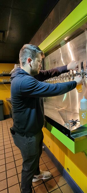 Brock Marlatt pours an All Dogs Go to Hefen at Icebox Brewing Co., Downtown Boneyard Cantina location.