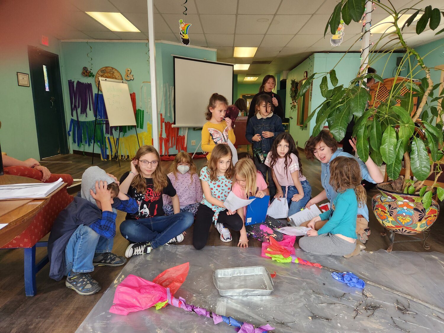 Hallie Harris, with Spring Drama Campers working on art project.
