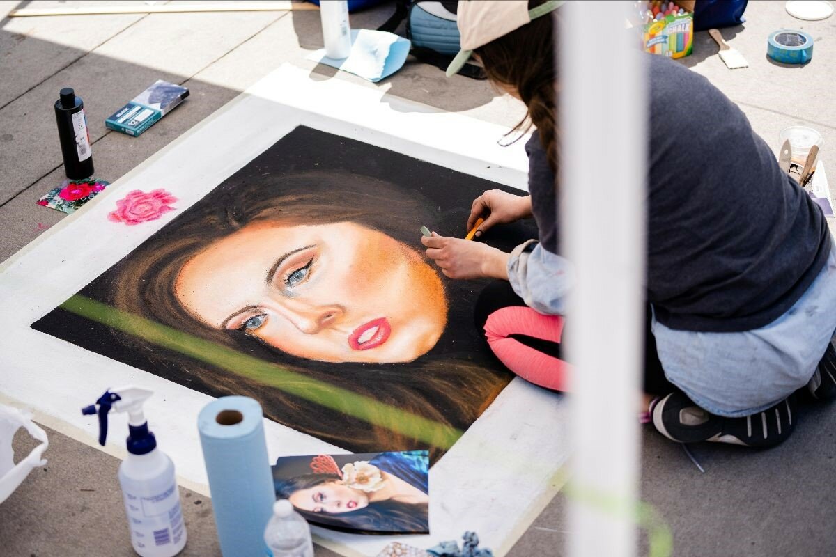 Brigette Kearns creates a winning work of chalk art at the city’s ¡Mira! Las Cruces Arts & Culture event April 29.