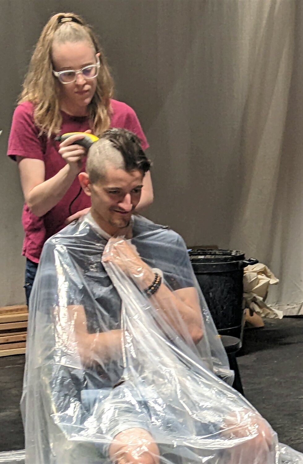 “Bat Boy: the Musical” co-director Sage Drake gives actor Christian Nieves a haircut in preparation for his performance in the title role. Nieves’ hair was donated to Locks of Love.