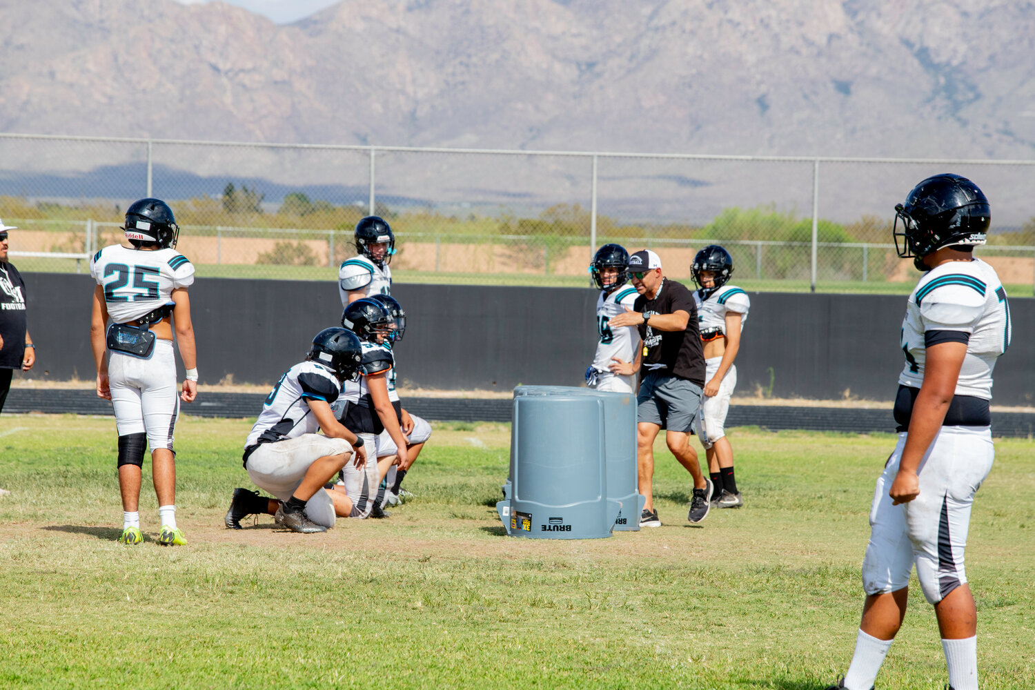 New Head Coach Kenny Sanchez gives instruction to some of his Organ Mountain High School Knights. The other new head coach in town is Gary Bradley at Mayfield High School.