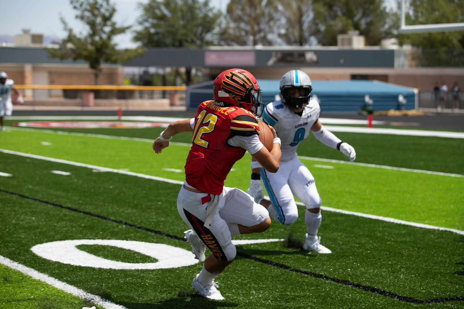 A Centennial High School ballcarrier eyes the end zone Aug. 19 during the Hawks’ 27-8 loss to No. 1-ranked Cleveland High School from Rio Rancho.