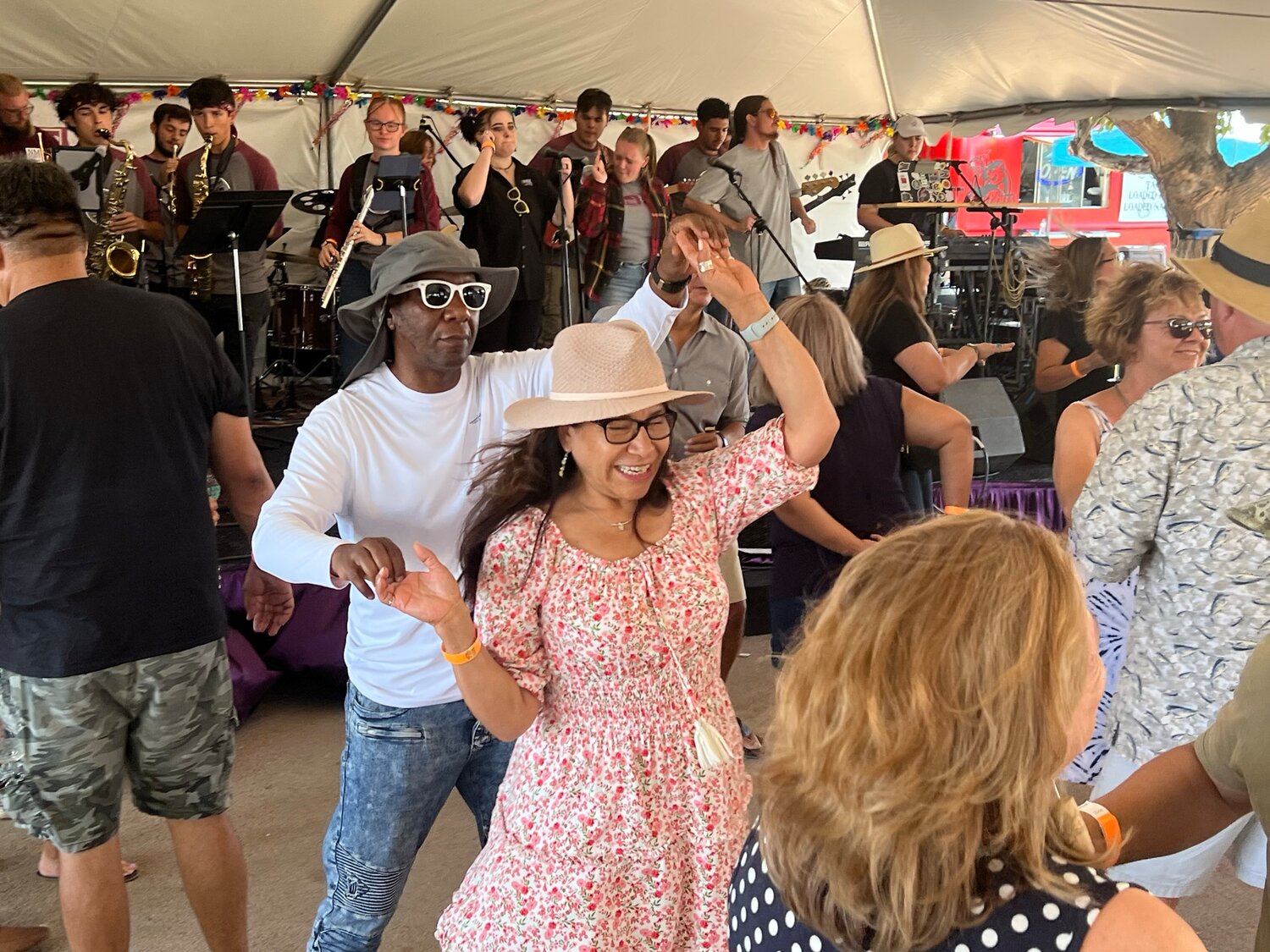 Relaxing on Labor Day, people enjoy their Monday afternoon at the New Mexico Harvest Wine Festival held at the Southern New Mexico Fairgrounds Sept. 2-4. New Mexico State University’s Proud Pete play a variety of covers as people dance the afternoon away.