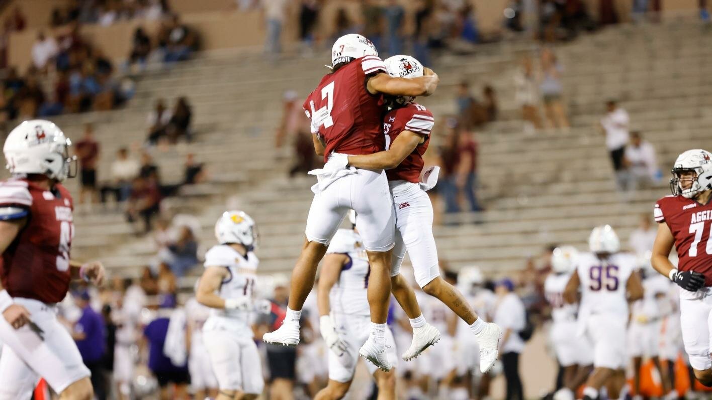 Aggies celebrate after a score in their 58-21 victory over Western Illinois Sept. 2 in Las Cruces.