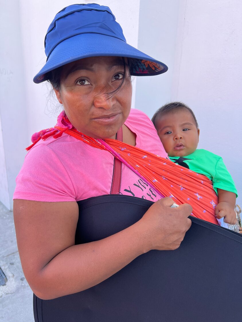 Mixteca woman with baby selling trinkets near
Santa Teresa
