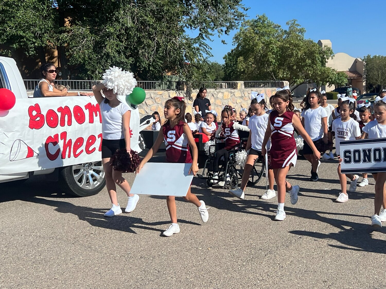 Young Sonoma school cheer leaders prepare to strut their stuff for the Diez y Seis de Septembre, aka Mexican Independence Day, parade Saturday, Sept. 16.