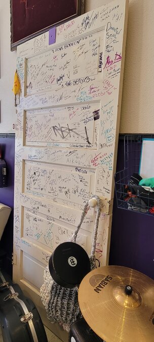 The Artist Door that is signed by musicians that play at the venue.
