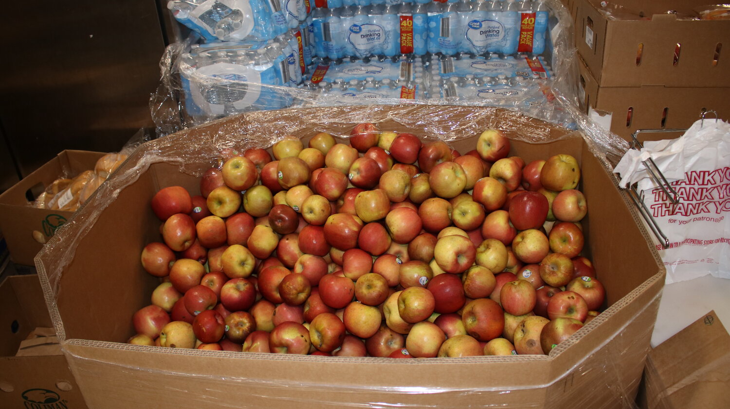 Apples await sorting into baskets that will in turn be given to residents in need of food assistance at Casa de Peregrinos emergency food pantry in Las Cruces in late July 2023.