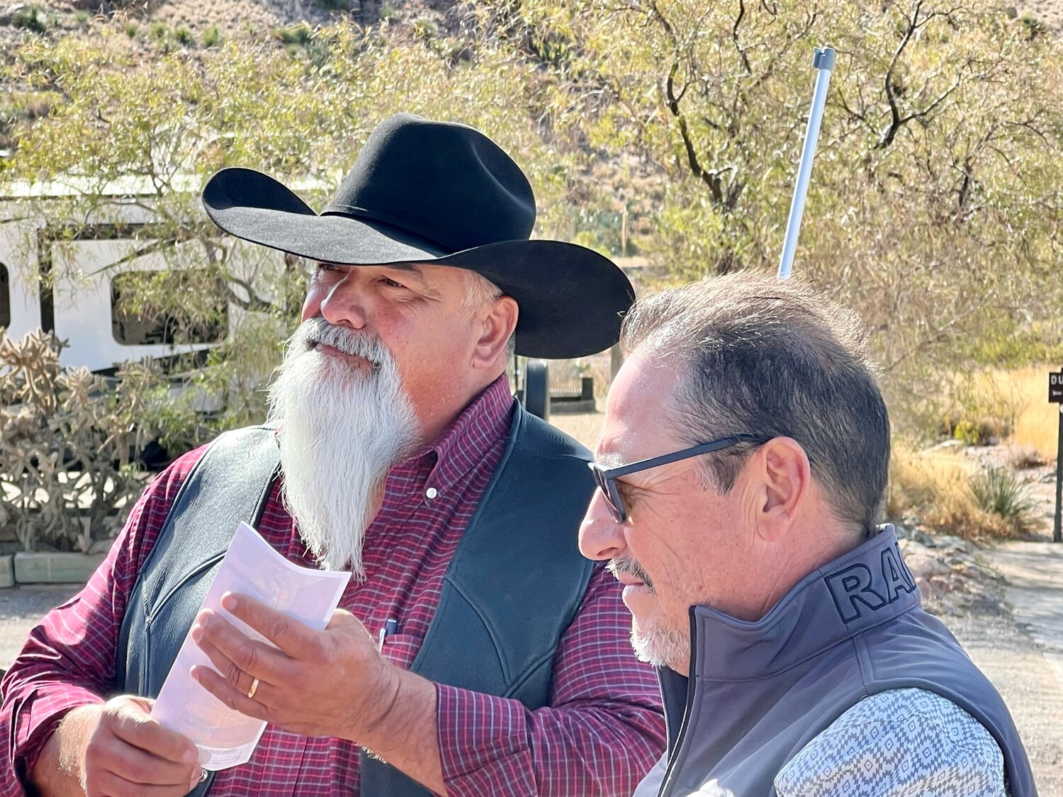 Luna County rancher Eddie Mesa, left, was among the spectators who confronted Luna County Commissioner Ray Trejo, right, and other proponents of a Luna County national monument after a campaign launch event at Rockhound State Park near Deming on Dec. 6.