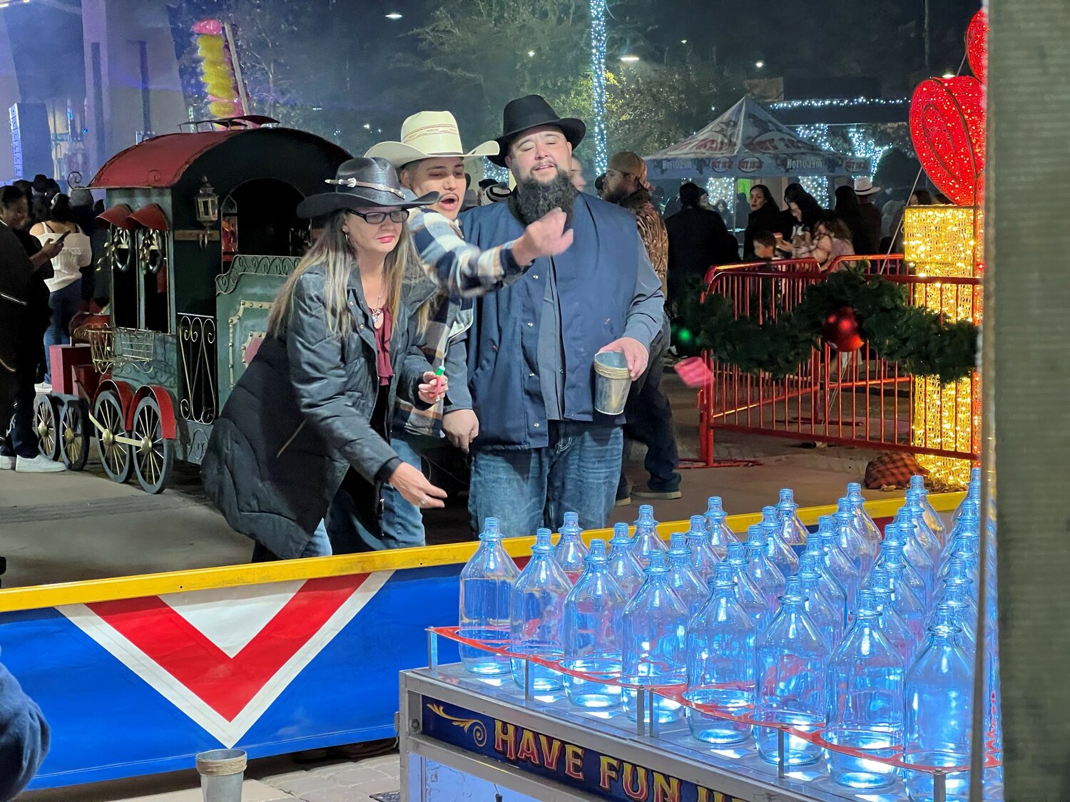 The New Year’s Eve Chile Drop included live music, dancing, food and refreshments and an array of carnival games like this ring toss enjoyed by children and adults alike.