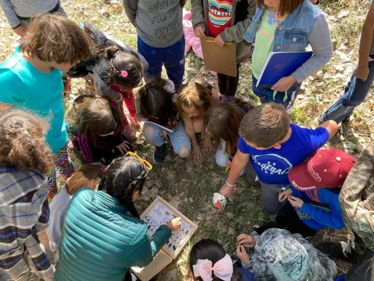 Students are seen participating in an event with the Bosque Ecosystem Monitoring Program in Bernalillo County.