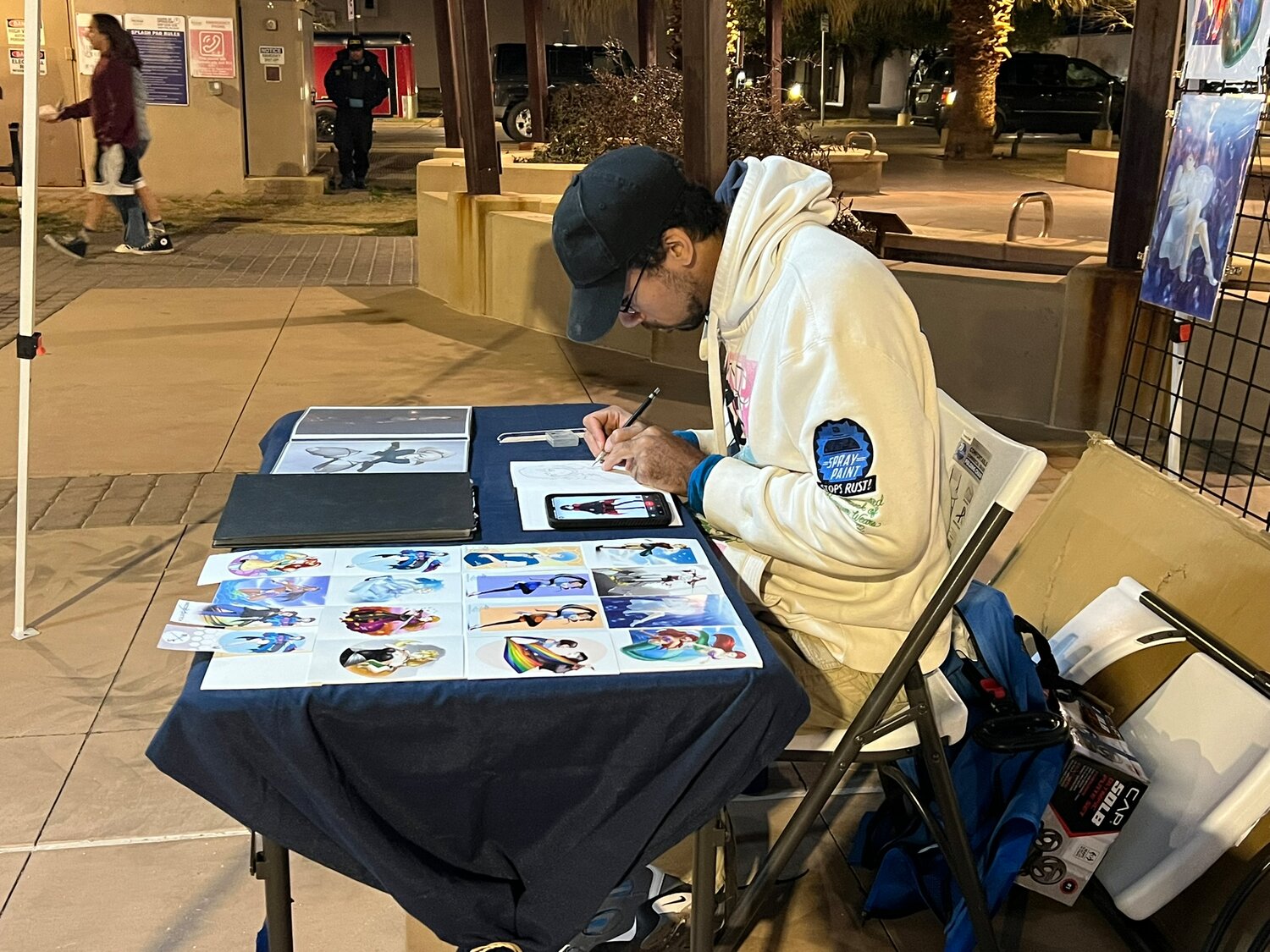 Sean Robinson continues his work on Plaza de Las Cruces during the Arts Flea Market evening event Friday, Feb. 2 during the kick-off arts crawl For the Love of Art month. Visit artformsnm.org for more information about special events taking place all month.