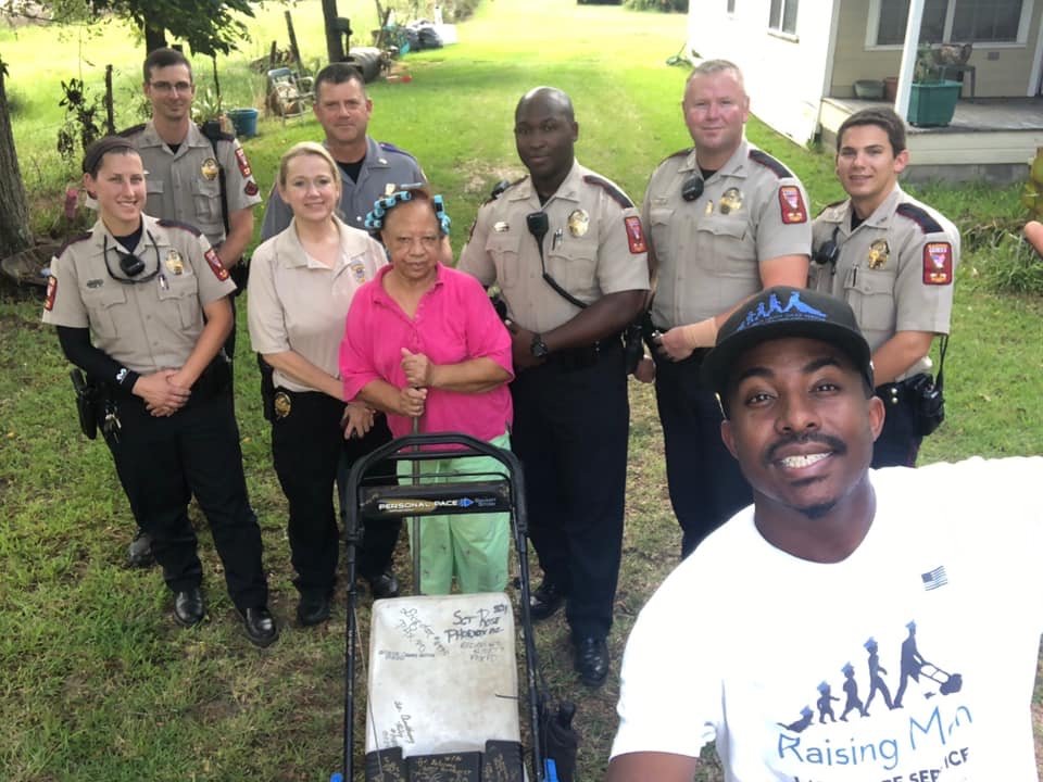 Madison police officers pitch in to help volunteer mow yard