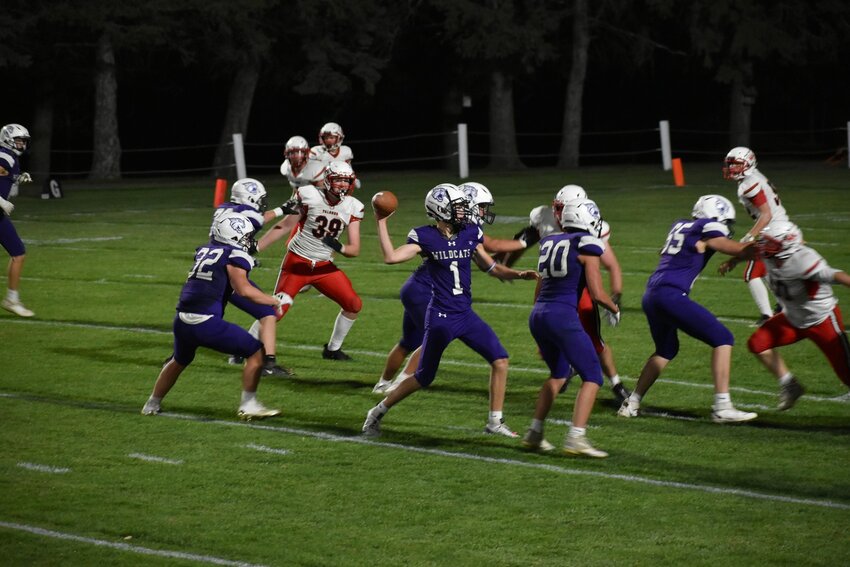 Nathan Beck running the ball with Jack Carlson blocking