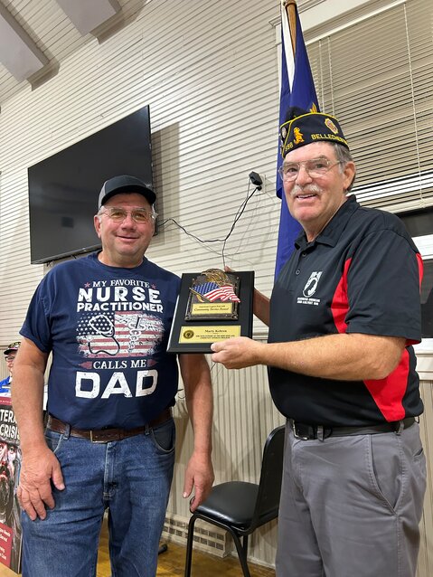 Commander John Huneke presenting the award to Marty Kehren.