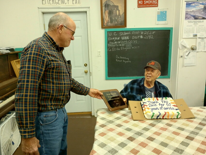 At the Ellington Township's annual meeting on Tuesday March 11th, Dave Wetzstein was presented a 50 year service plaque. Here Tom Coffman is presenting the plaque to Dave Wetstein.