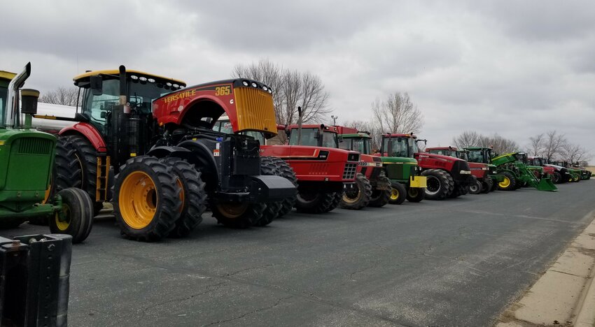 About two dozen tractors and related farm equipment lined the street of the school parking lot on April 11th.