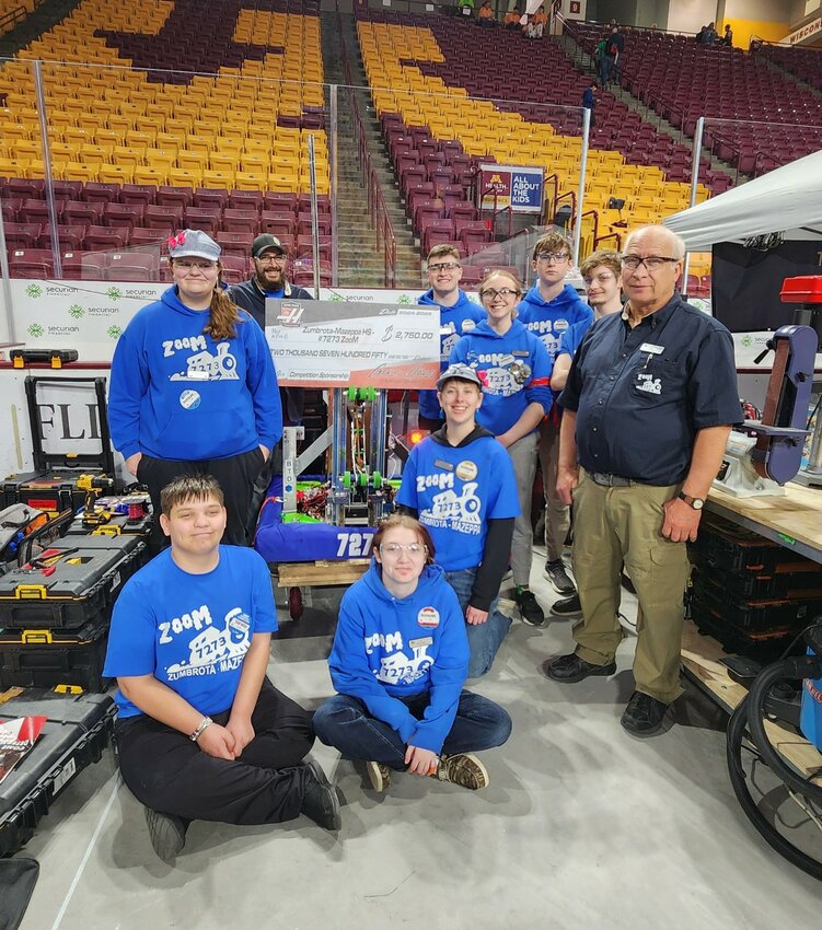 From back left, Kloe Smith, Brandon Brady (coach), Ayden Smith, Emily Meyers, Aidan Rolland, Caden Brady (mentor), Jim Perrotti (head coach), From front left: Niki Reiland, Macy Brady, Norah Groby
