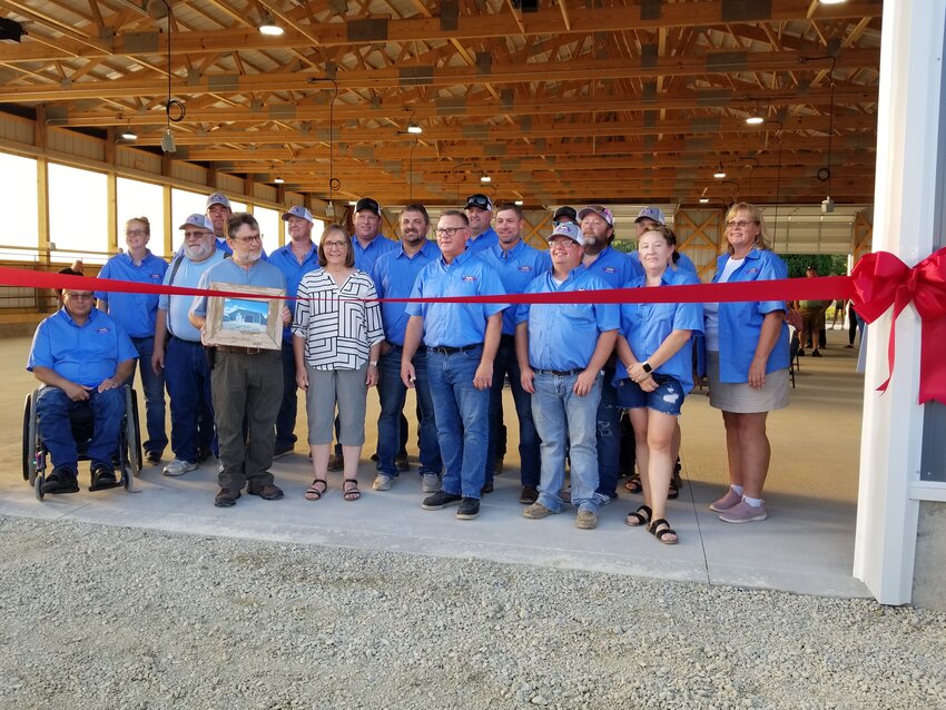 Fairboard members with Nick and Cindy Fisher-Broin (front left) representing the Lowell Broin family who donated the money for construction of the new cattle barn on the Goodhue County Fairgrounds.
