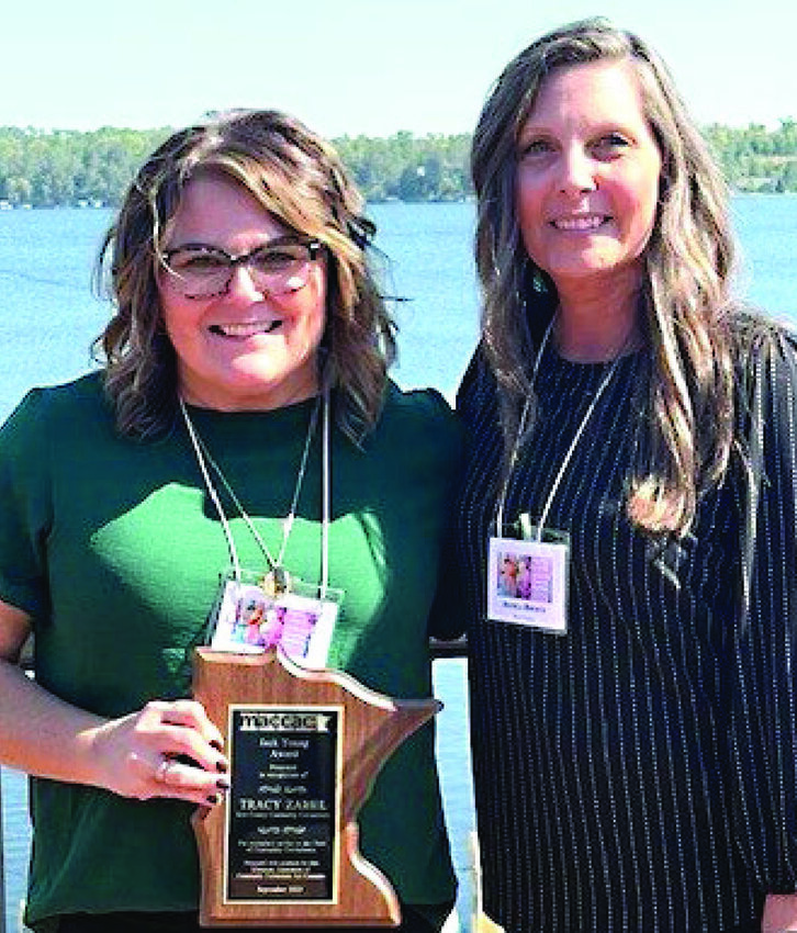 Community Corrections Supervisor Tracy Zabel, left, poses with her award for excellence in Corrections. She was nominated by her supervisor, Angela Brewer, right.