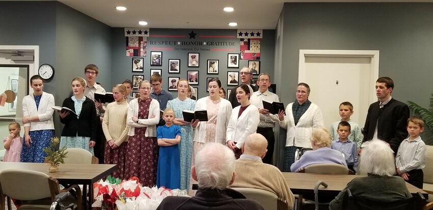 The many voices of all ages sang acapella Christmas carols for Goodhue Living residents on December 23rd.  Members of the Mennonite church visit once a month and also sing at other senior living communities, private homes and other places.