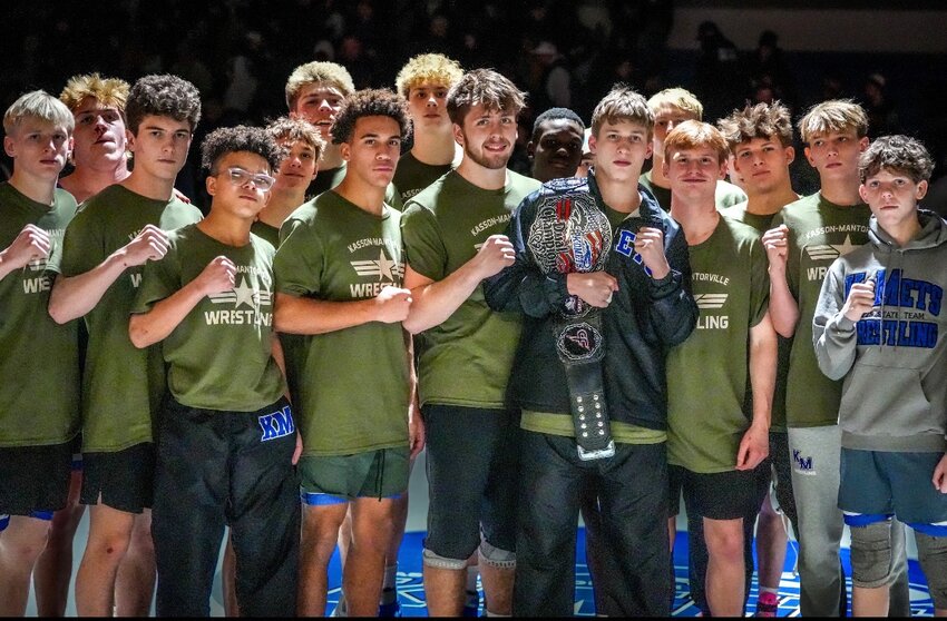 Angie Richards (K-M celebrates a victory over rival Z-M). The dual marked the inaugural battle for the Dual Champions Belt, a traveling trophy honoring the rivalry between these two wrestling powerhouses.