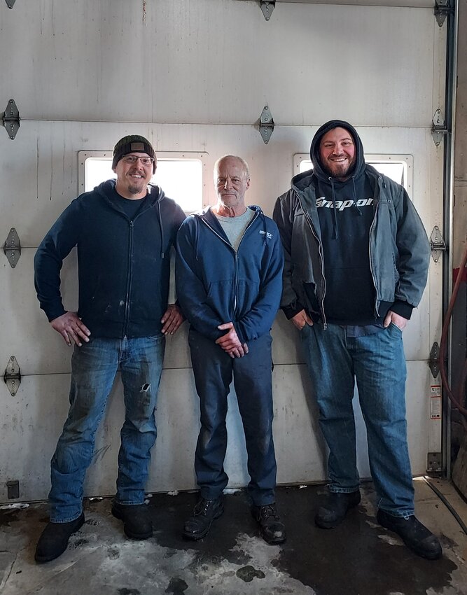 Wade Nygaard with employees Snitzer and Louis