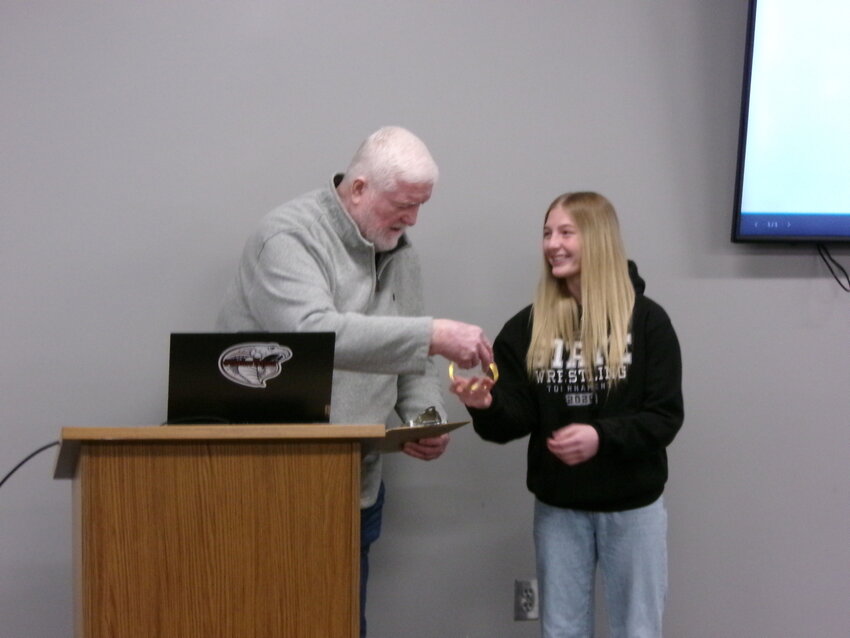 Dodge Center Mayor, Bill Ketchum, presents Adrianna Kunz with an award