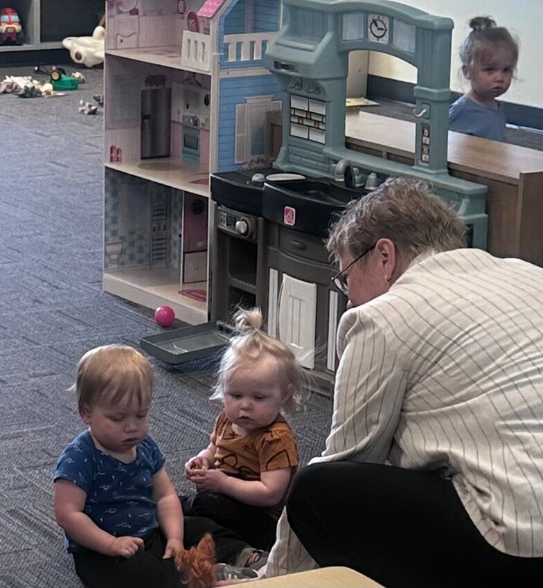 Commissioner Burnham interacting with children in the program