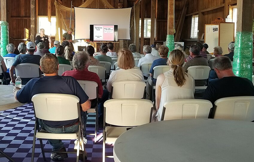 Dave Betcher and Ann Nibbe speak during a power point presentation for Goodhue County Holstein Association members, past members and guests.