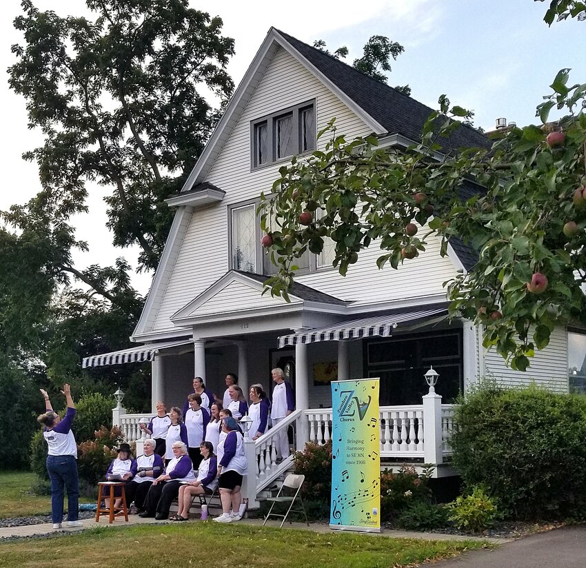 The Zumbro Valley Chorus practices on Deb Stern's front porch August 18th.