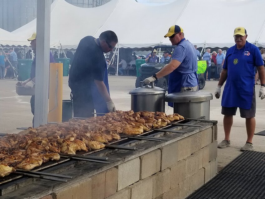 Goodhue Lion's members grilling some of the 4,000 pounds of meat for their 62nd annual chicken BBQ Sunday, August 16th.