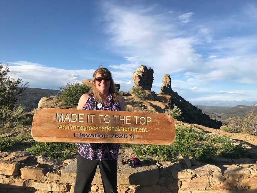 Cheryl Uhl stands atop the mesa at Chimney Rock National Monument. The Chimney Rock Interpretive Association will be holding its annual volunteer training on April 26 and 27.