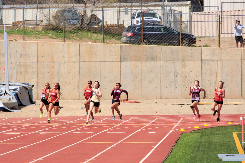 Lady Pirate Rylie Carr works to set a new school record in the 200-meter dash at the Ron Keller Invitational on Saturday, April 20. Carr beat her own record, logging a time of 26.12 seconds.