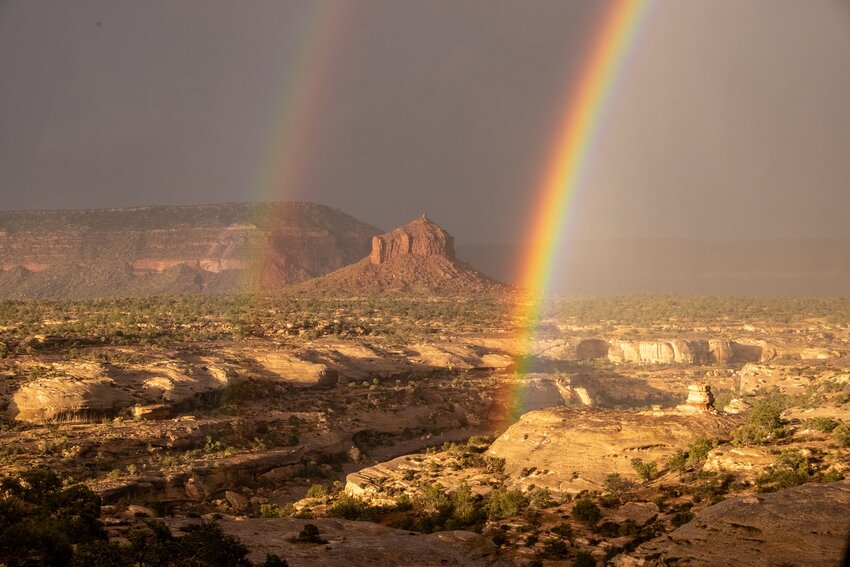 Rainbows appear over Utah’s Cheesebox Butte.